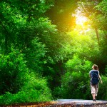 woman walking through park