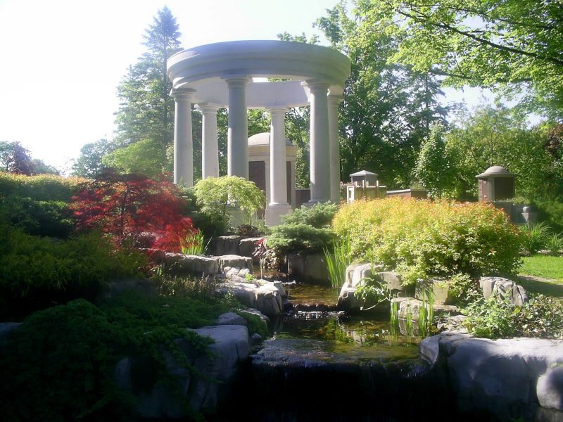 A photo of a garden and waterfall at Woodlawn Memorial Park.