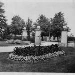 Old black and white photo of the Woodlawn Memorial Park front gates