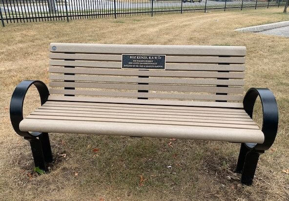 Memorial bench with plaque installed