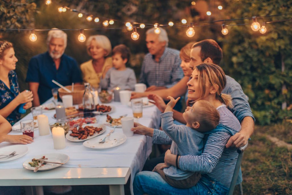 Family gathered around an outdoor table