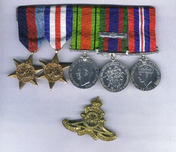 A photo of medals from World War II on a white background.